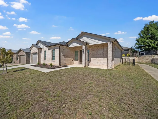 a view of a large house with a yard