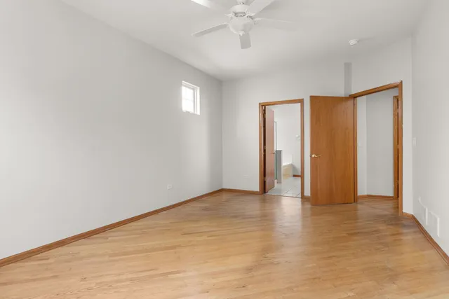 a bathroom with a double vanity sink a toilet and a mirror