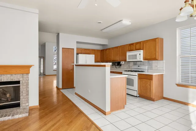 a kitchen with stainless steel appliances a sink stove and refrigerator