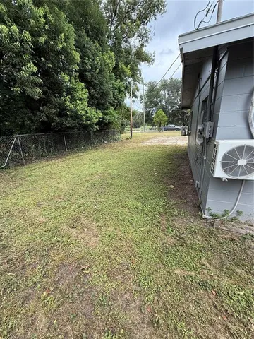 a backyard of a house with lots of green space