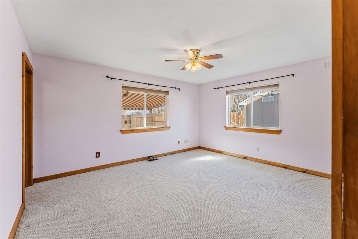 316 3rd Street Fairplay, CO 80440 - Photo 16 of 37 an empty room with windows and ceiling fan