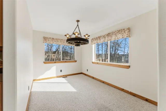 a kitchen with a sink stove top oven and cabinets