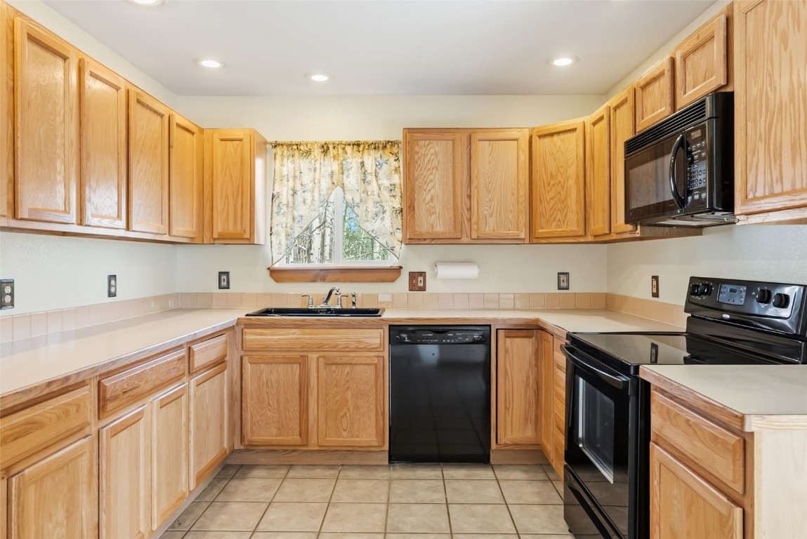 316 3rd Street Fairplay, CO 80440 - Photo 7 of 37 a kitchen with a sink stove top oven and cabinets