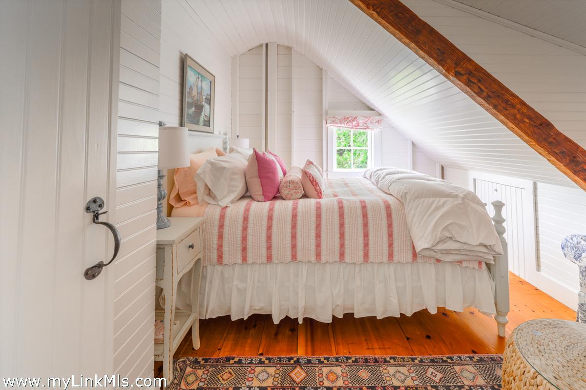 14 & 16 Coffin Street Nantucket, MA 02554 - Photo 42 of 50 a bedroom with a bed and a window