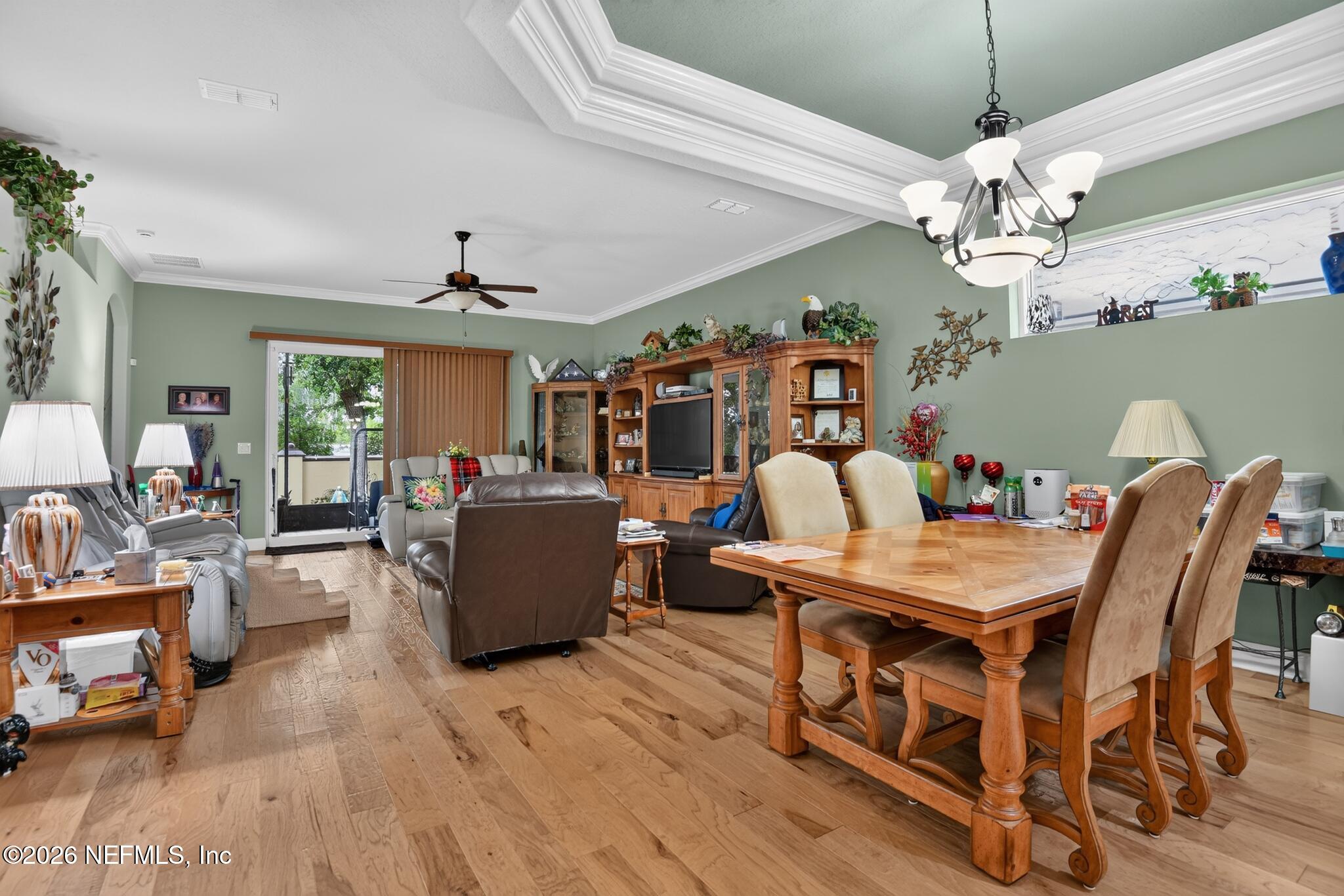 110 Vía Roma Ormond Beach, FL 32174 - Photo 12 of 43 a view of a dining room with furniture and chandelier