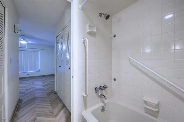 a bathroom with a bathtub and shower
