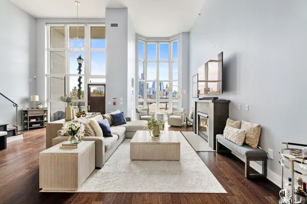 a living room with furniture and a large window
