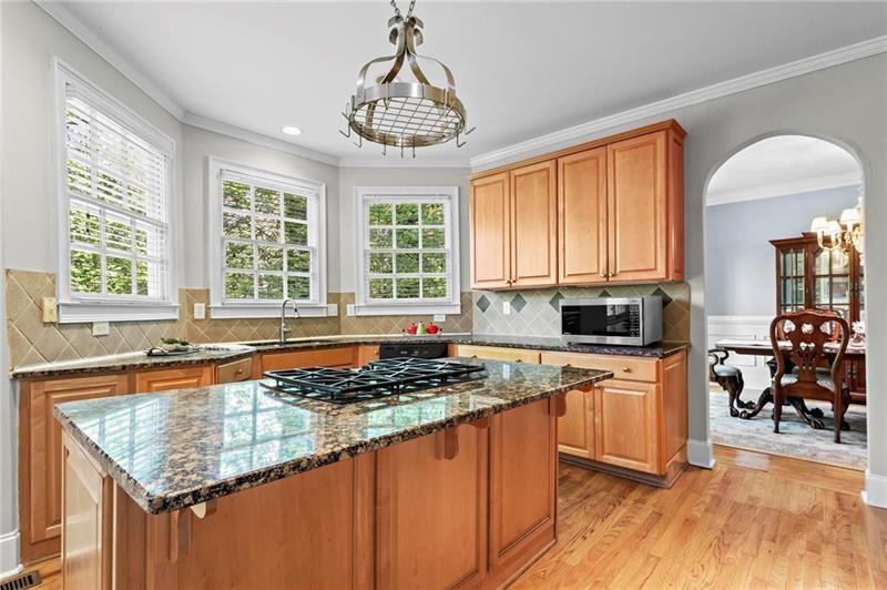 1169 Dawn View Lane Northwest Atlanta, GA 30327 - Photo 13 of 61 a kitchen with stainless steel appliances granite countertop a stove top oven a sink dishwasher and cabinets with wooden floor