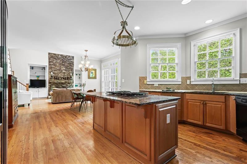 1169 Dawn View Lane Northwest Atlanta, GA 30327 - Photo 14 of 61 a kitchen with stainless steel appliances granite countertop a stove and a wooden floors