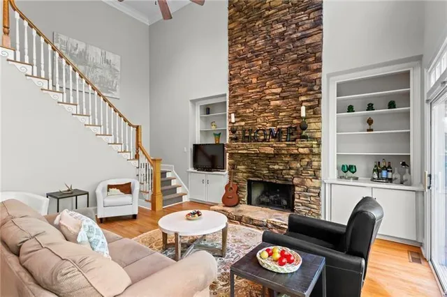 a living room with furniture and a fireplace