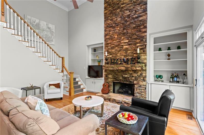 1169 Dawn View Lane Northwest Atlanta, GA 30327 - Photo 20 of 61 a living room with furniture and a fireplace