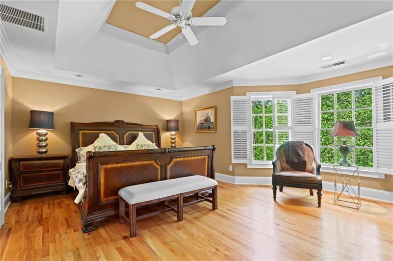 1169 Dawn View Lane Northwest Atlanta, GA 30327 - Photo 22 of 61 a bedroom with furniture and wooden floor