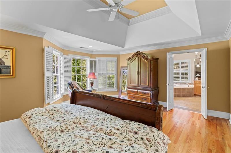 1169 Dawn View Lane Northwest Atlanta, GA 30327 - Photo 23 of 61 a bedroom with a bed and wooden floor