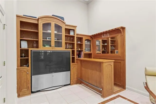 a kitchen with a table chairs and a fireplace