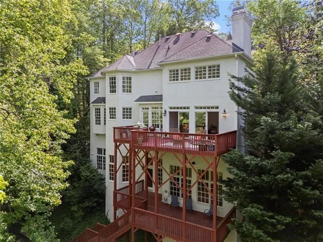 a view of a house with a yard porch and sitting area
