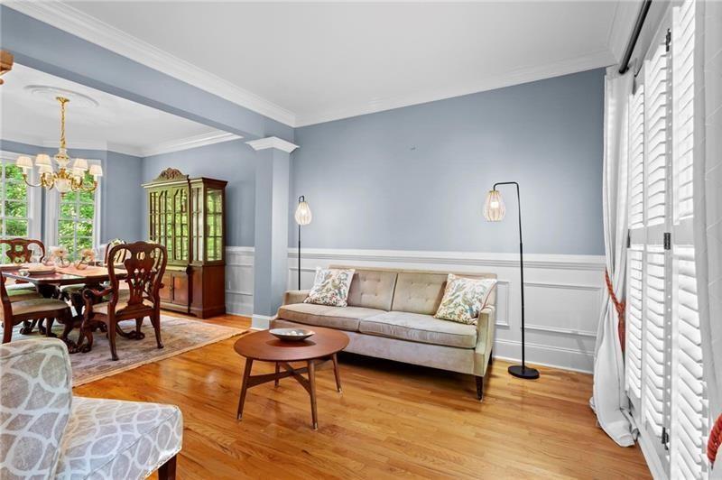 1169 Dawn View Lane Northwest Atlanta, GA 30327 - Photo 7 of 61 a living room with furniture and a wooden floor