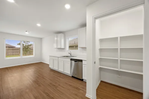 an empty room with a empty space and a window