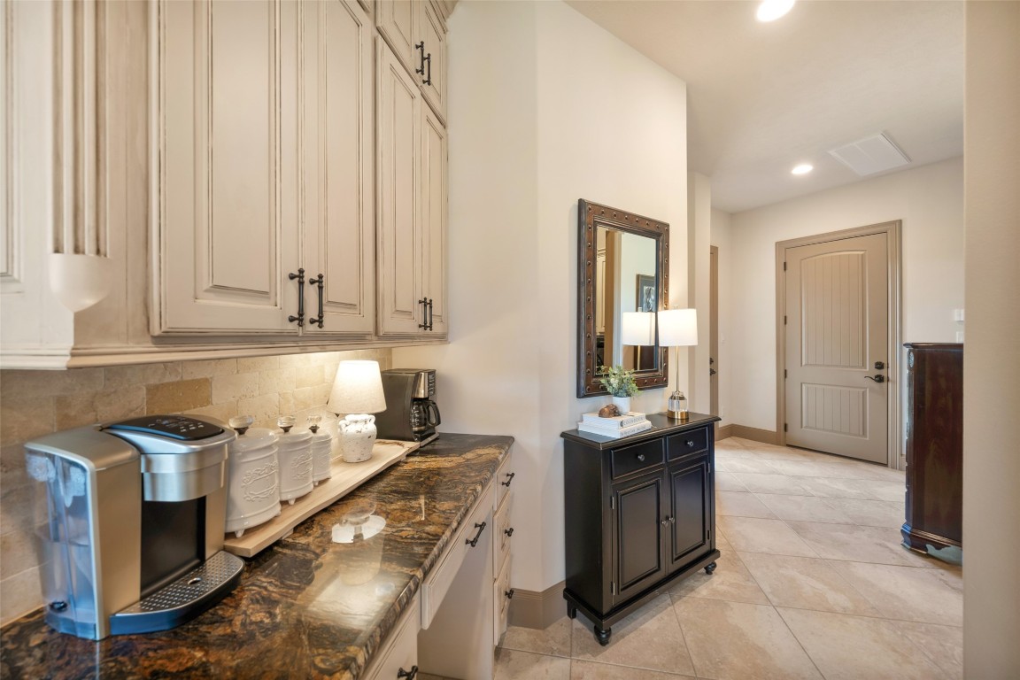 40 Stewart Road New Waverly, TX 77358 - Photo 12 of 50 a kitchen with stainless steel appliances granite countertop a stove a sink and a refrigerator
