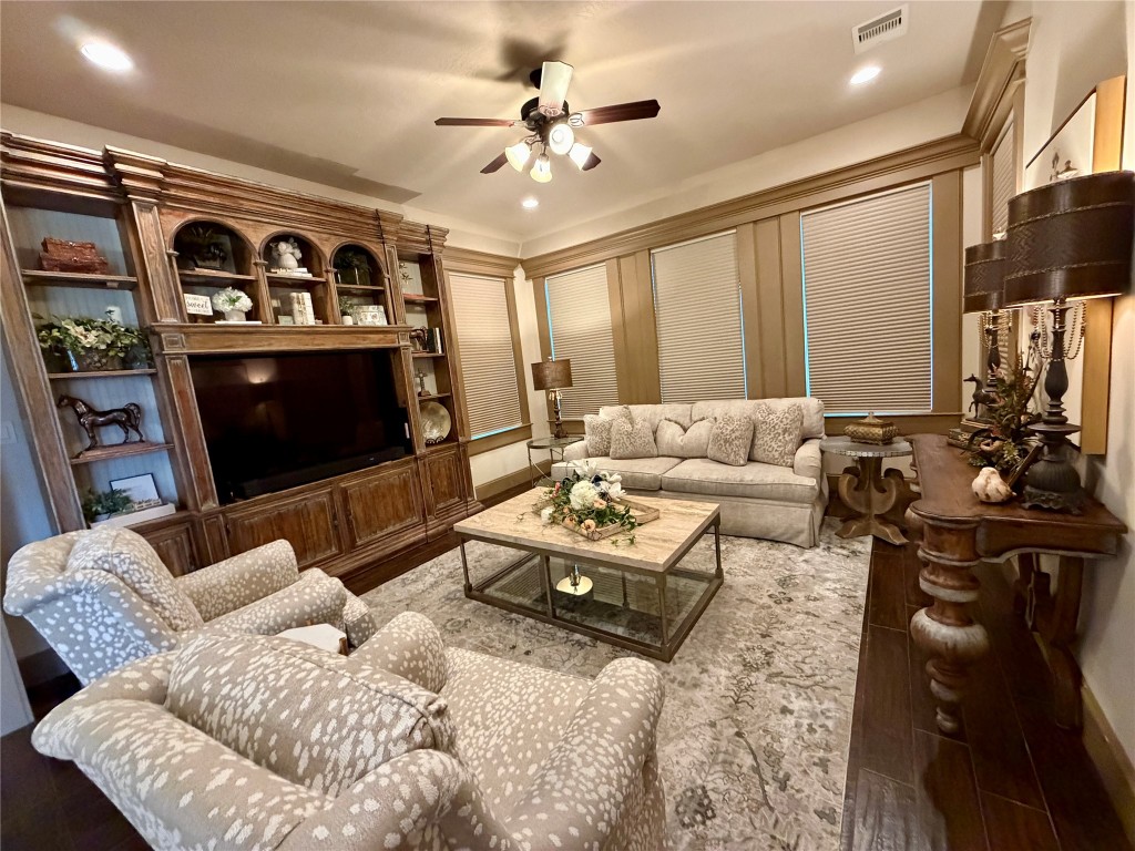 40 Stewart Road New Waverly, TX 77358 - Photo 14 of 50 a living room with furniture ceiling fan and a flat screen tv