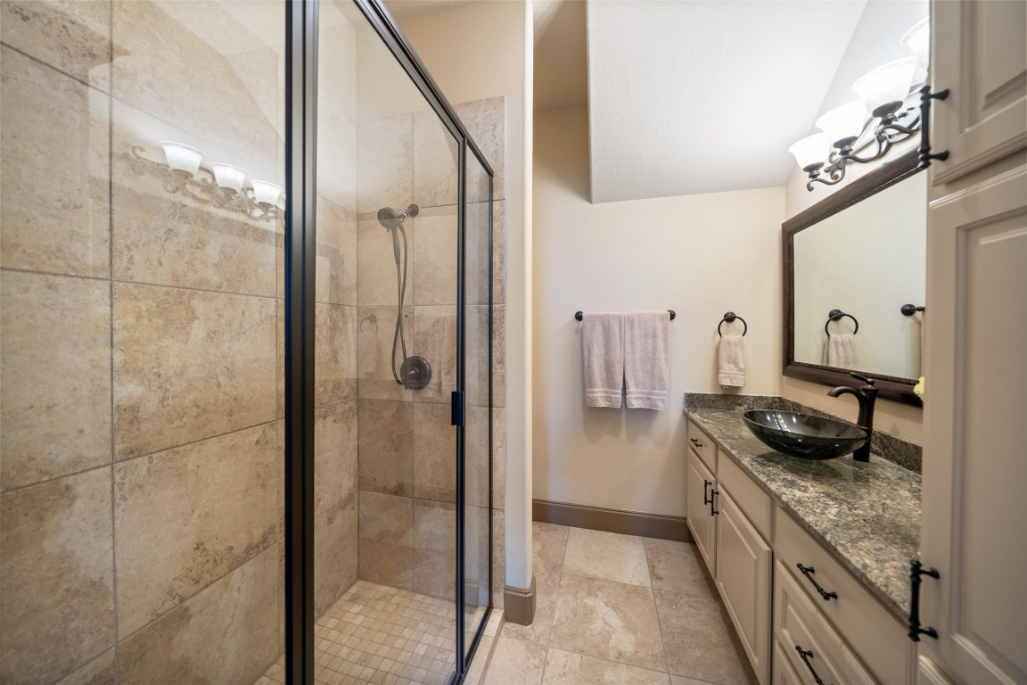 40 Stewart Road New Waverly, TX 77358 - Photo 20 of 50 a kitchen with a granite countertop sink and refrigerator