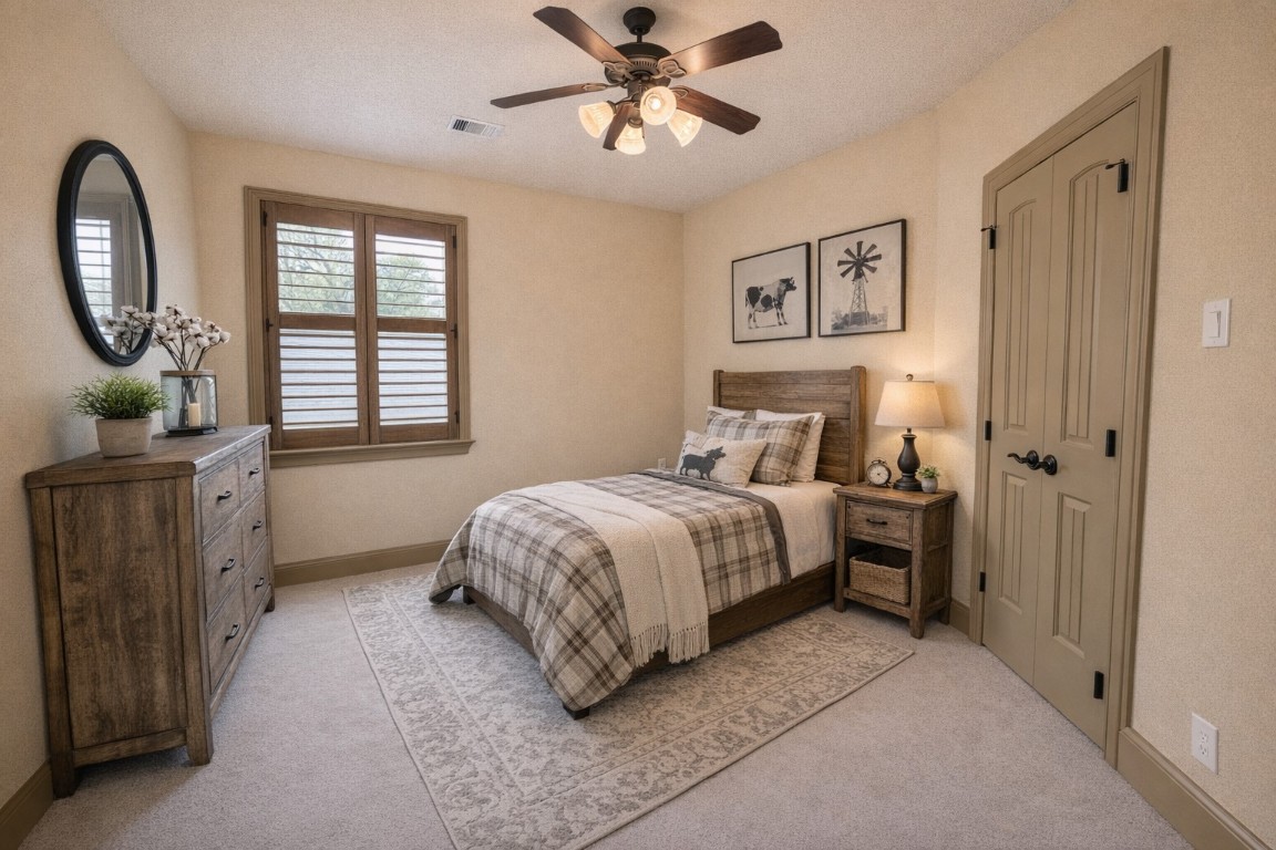 40 Stewart Road New Waverly, TX 77358 - Photo 25 of 50 a bedroom with a bed and a chandelier