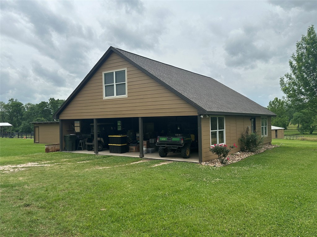 40 Stewart Road New Waverly, TX 77358 - Photo 29 of 50 a view of a house with a yard and sitting area