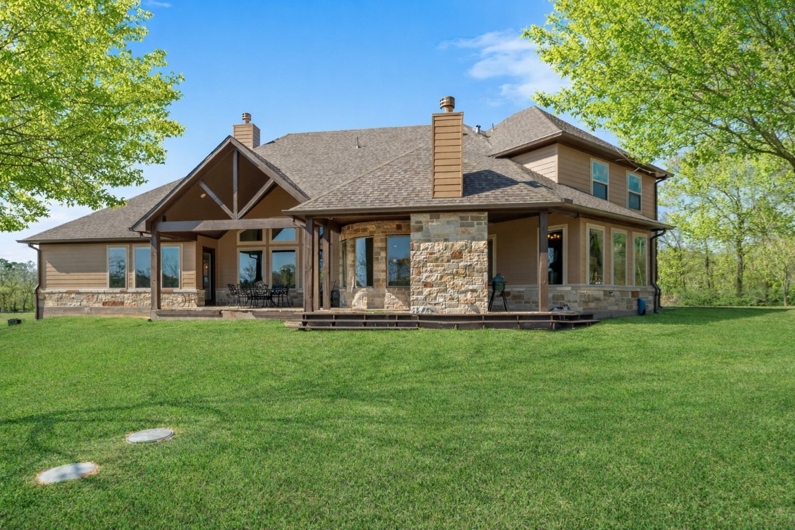 40 Stewart Road New Waverly, TX 77358 - Photo 3 of 50 a front view of a house with a garden