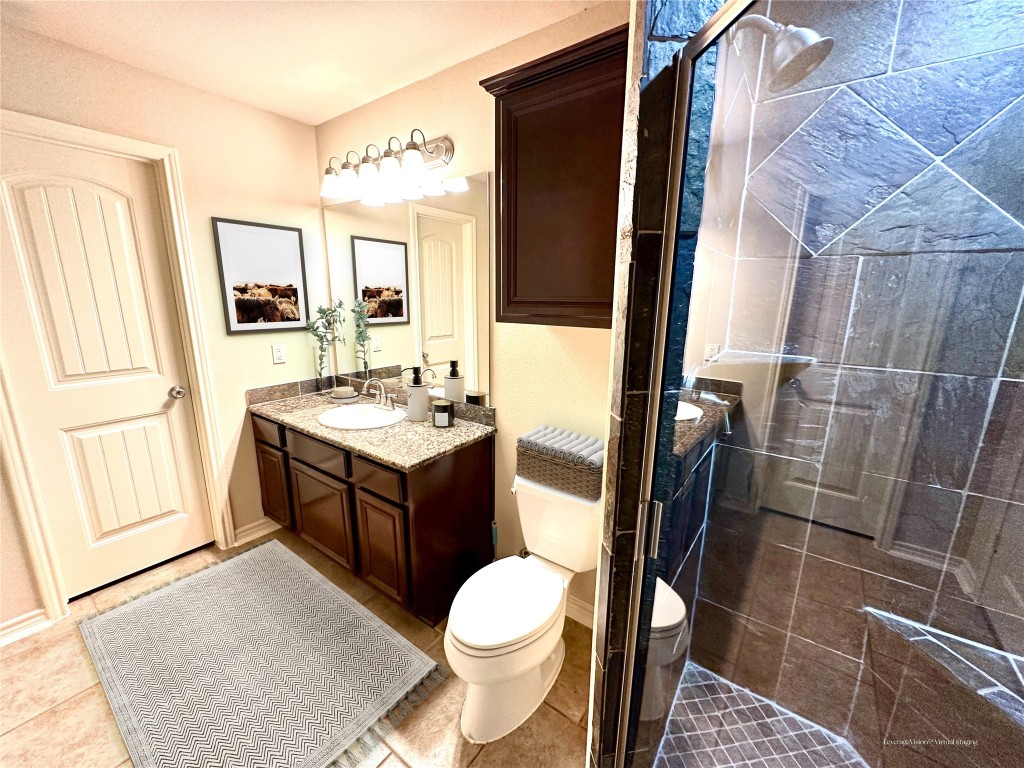 40 Stewart Road New Waverly, TX 77358 - Photo 36 of 50 a bathroom with a sink a toilet and shower