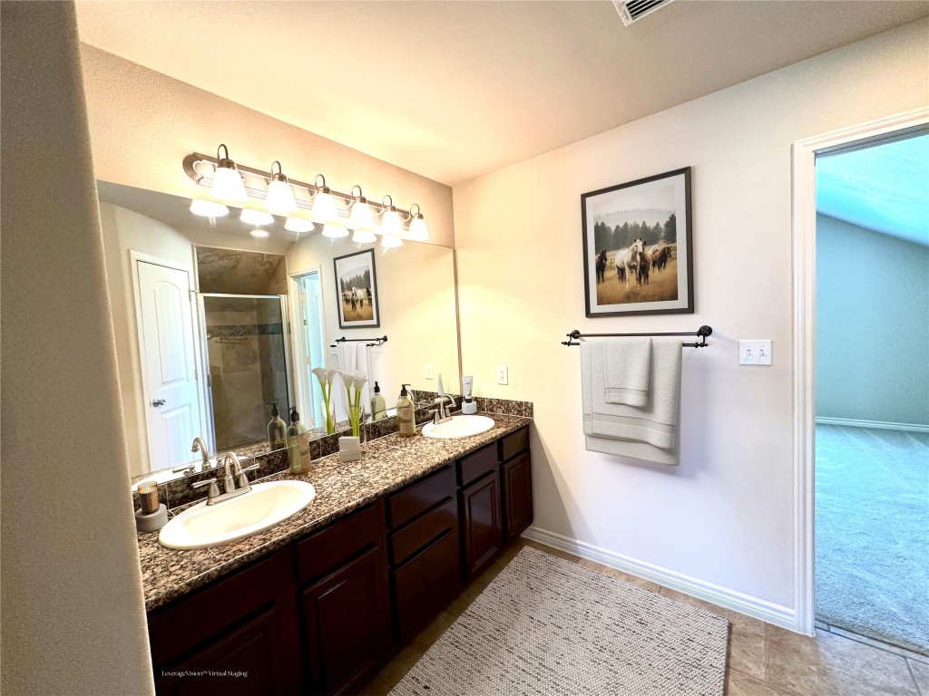 40 Stewart Road New Waverly, TX 77358 - Photo 38 of 50 a bathroom with a granite countertop sink mirror and