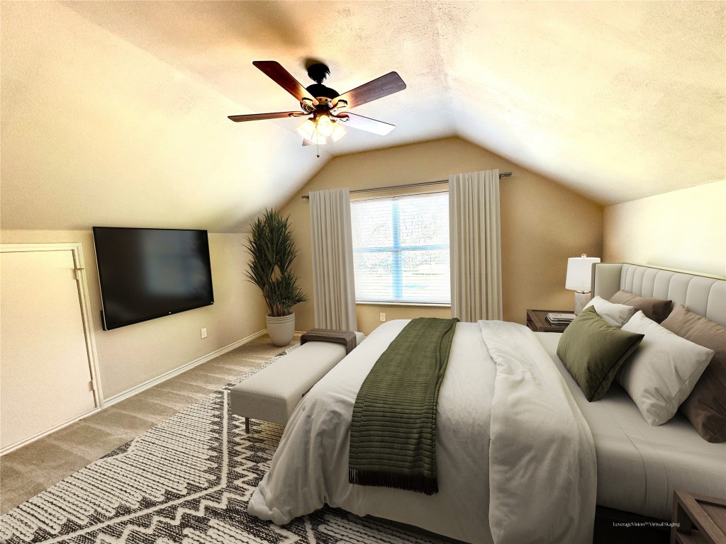 40 Stewart Road New Waverly, TX 77358 - Photo 39 of 50 a bedroom with a large bed and a flat screen tv