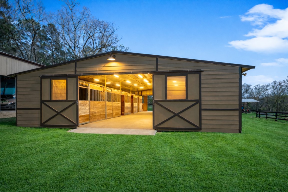 40 Stewart Road New Waverly, TX 77358 - Photo 40 of 50 a view of a backyard with a garden and entertaining space