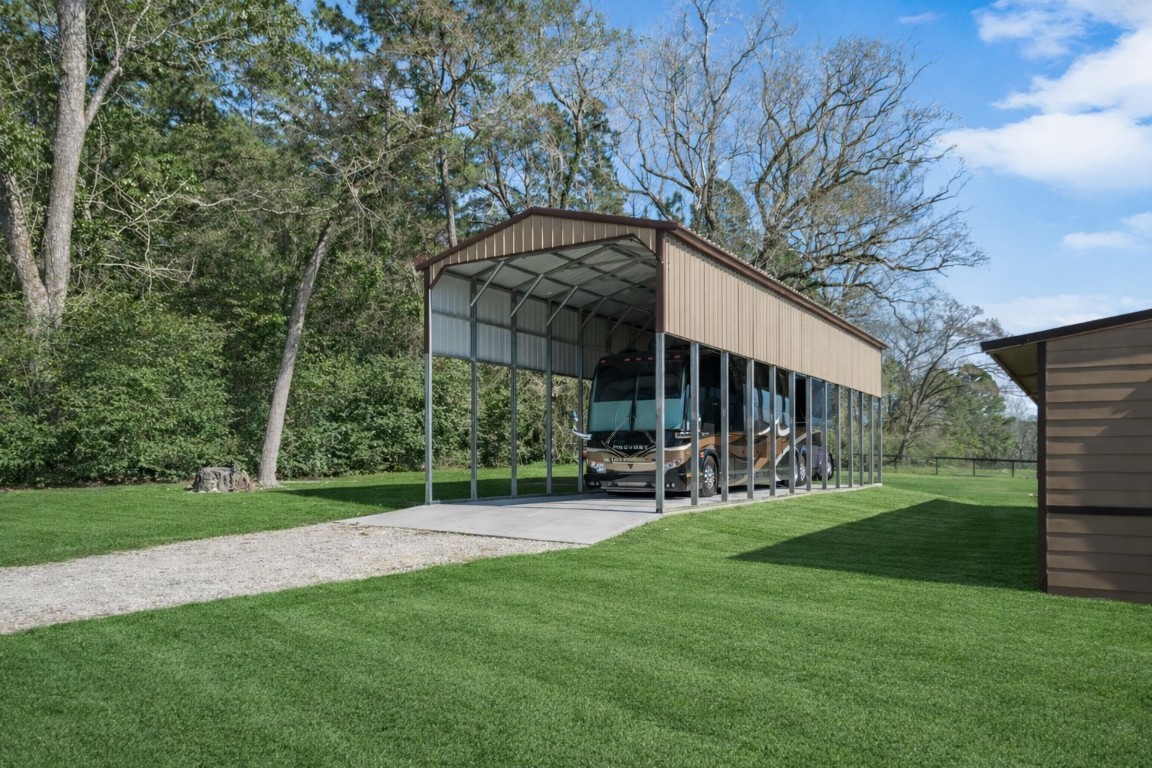 40 Stewart Road New Waverly, TX 77358 - Photo 41 of 50 a view of a chair and table in backyard