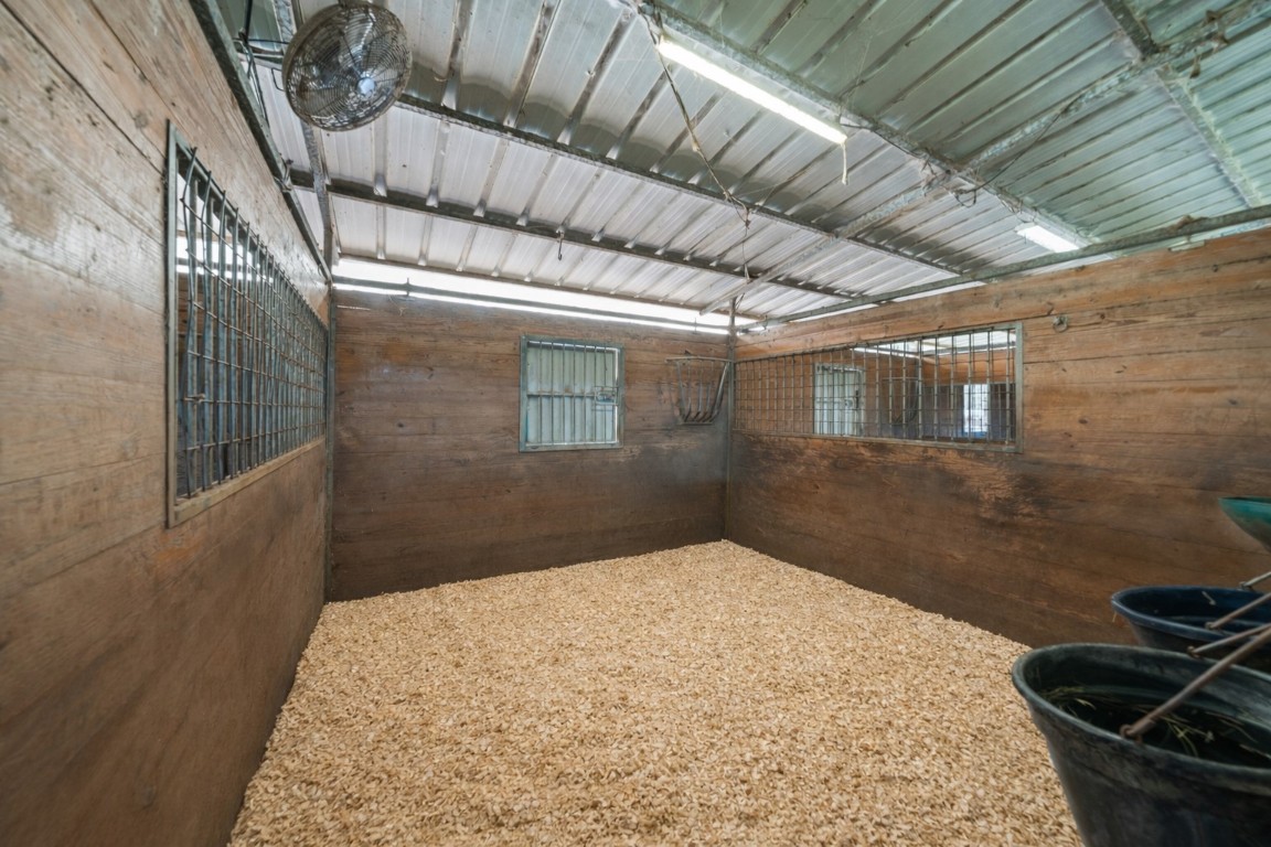 40 Stewart Road New Waverly, TX 77358 - Photo 48 of 50 a bedroom with a bed and wooden floor