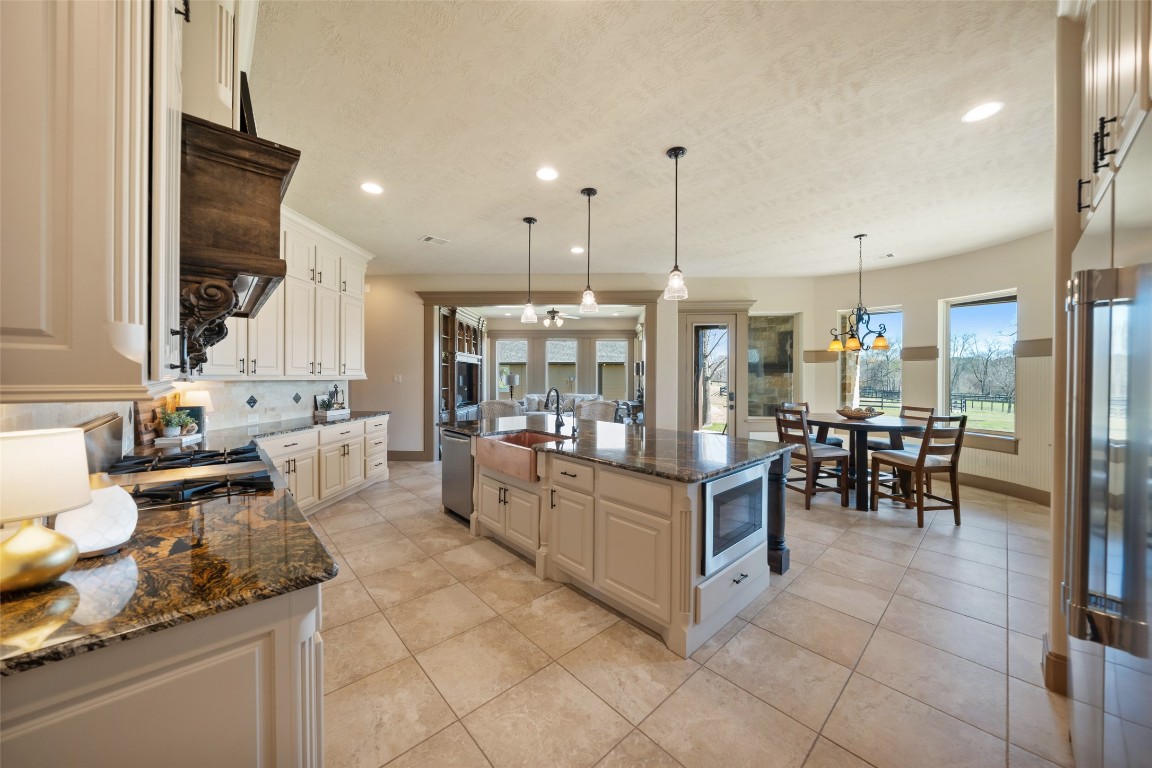 40 Stewart Road New Waverly, TX 77358 - Photo 8 of 50 a large kitchen with lots of counter and chairs