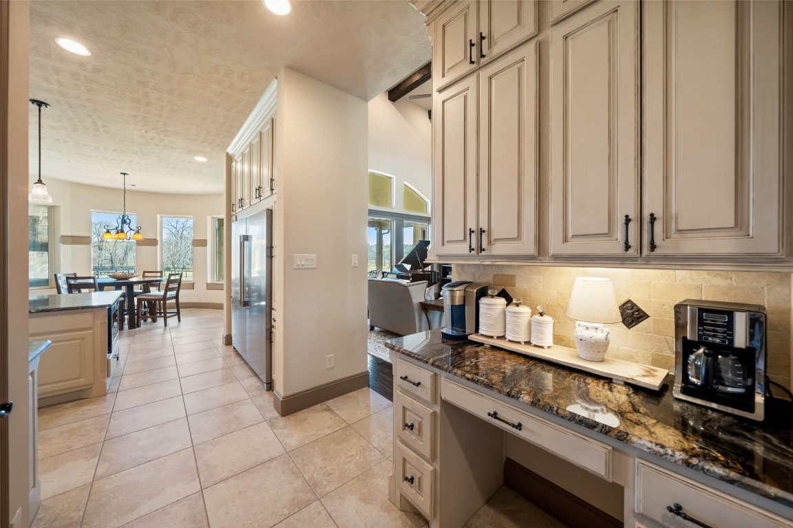 40 Stewart Road New Waverly, TX 77358 - Photo 10 of 50 a kitchen with stainless steel appliances granite countertop a refrigerator and a stove top oven