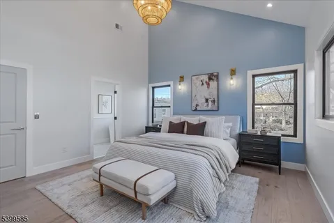 a bedroom with a bed couch and window