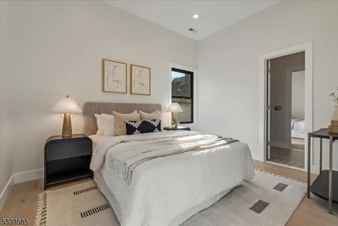 a bedroom with a bed and a lamp