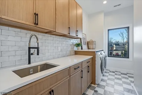 a kitchen with granite countertop a sink and a stove