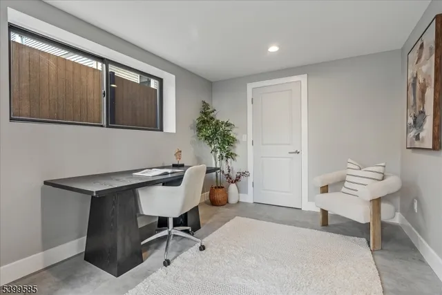 a workspace with furniture and window