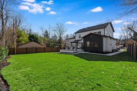 a view of a back yard of the house and green space