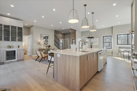 an open kitchen with a table and chairs in it