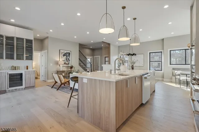 an open kitchen with a table and chairs in it