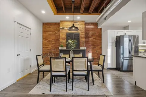 a dining room with furniture and window