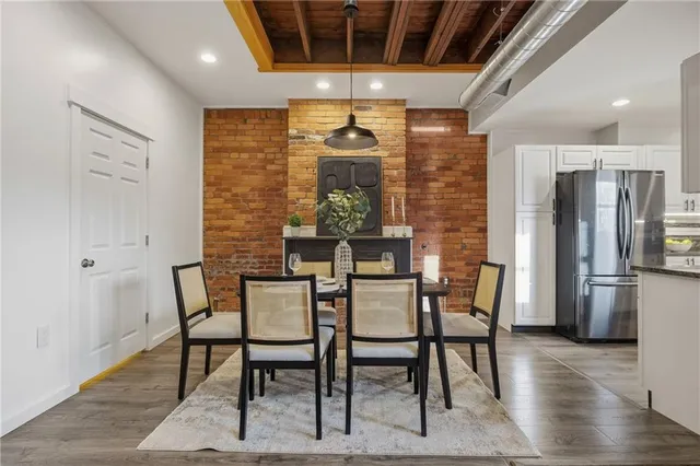 a dining room with furniture and window
