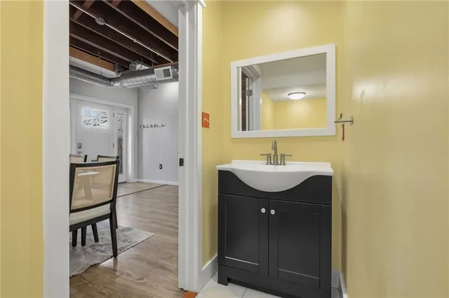 a bathroom with a sink and a mirror