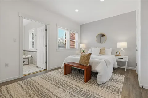 a bedroom with a bed and a table