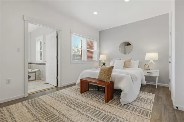 a bedroom with a bed and a table