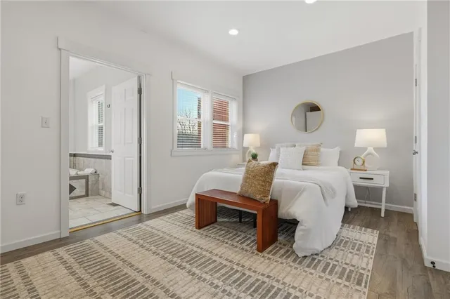 a bedroom with a bed and a table