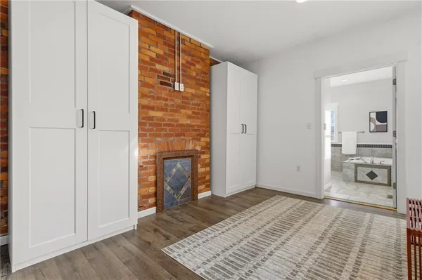 a bedroom with a bed and a mirror