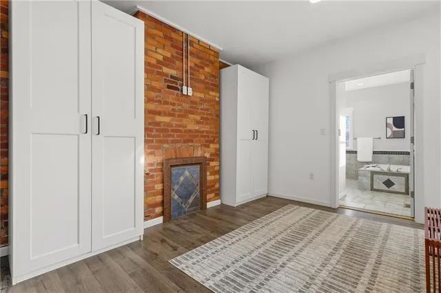 a bedroom with a bed and a mirror